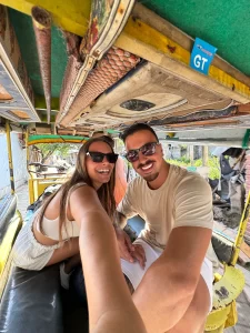Couple smiling while riding a cidomo in Gili Trawangan.