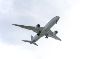 Airplane in the sky representing flights from Australia to Bali and Lombok for island travel