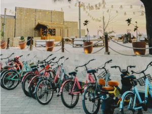 Colourful rental bicycles parked outside a beachfront café in Gili Trawangan, a popular way for visitors to explore the island without motor vehicles.