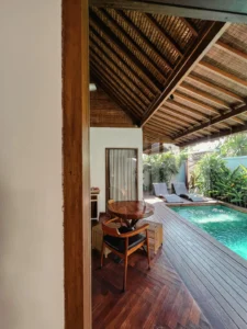 Private pool villa deck with wooden loungers at Pera ONE Villas, Gili Trawangan